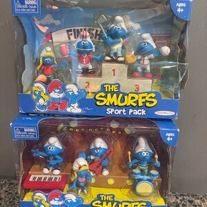 Two Smurf Toy Sets band and sports